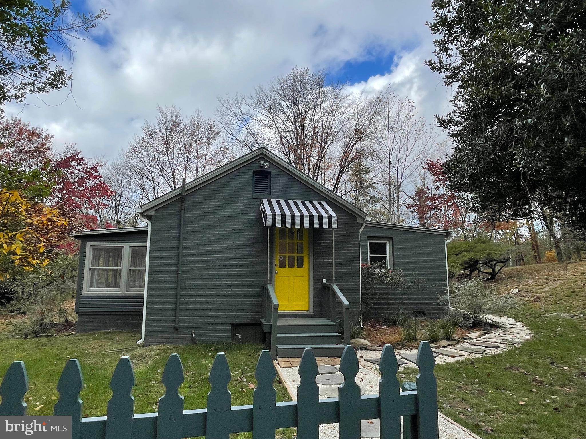 240 Whorton Hollow Road Castleton, VA 22716 - Photo 2 of 24 a view of two chairs in the backyard