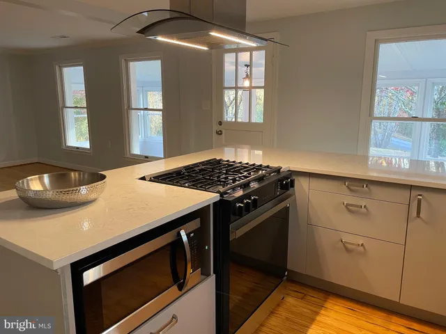 a kitchen with a stove and a sink