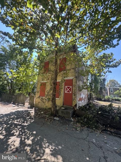 222 Byram Street Chester, PA 19013 - Photo 3 of 7 a sign that is sitting in front of a tree