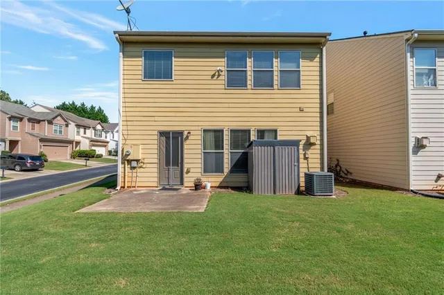 a view of a house with backyard sitting area and porch
