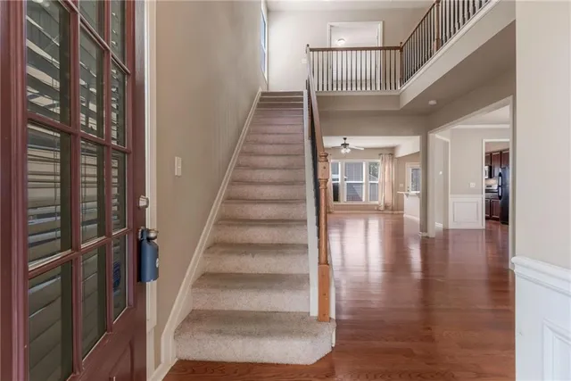 a view of staircase with white walls and windows