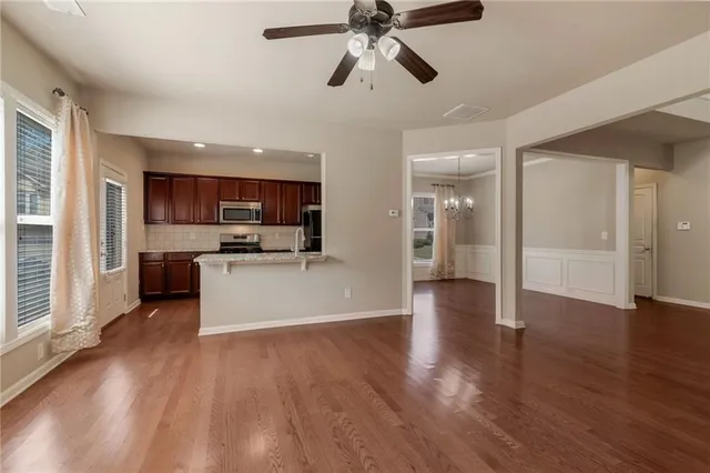 a view of a kitchen with a sink and a window