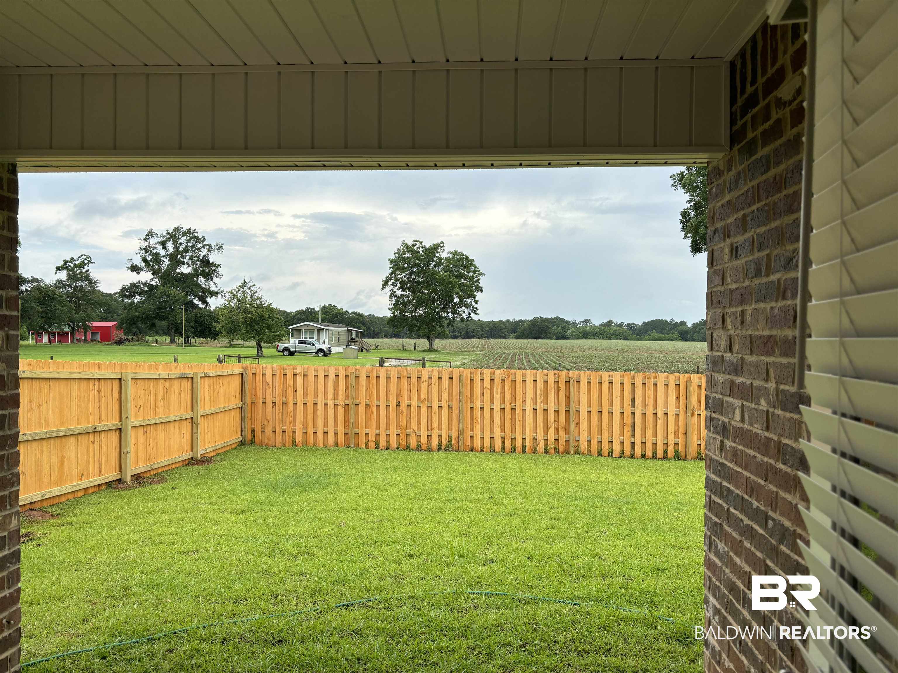 24516 Ponder Loop Loxley, AL 36551 - Photo 5 of 49 Fenced Backyard