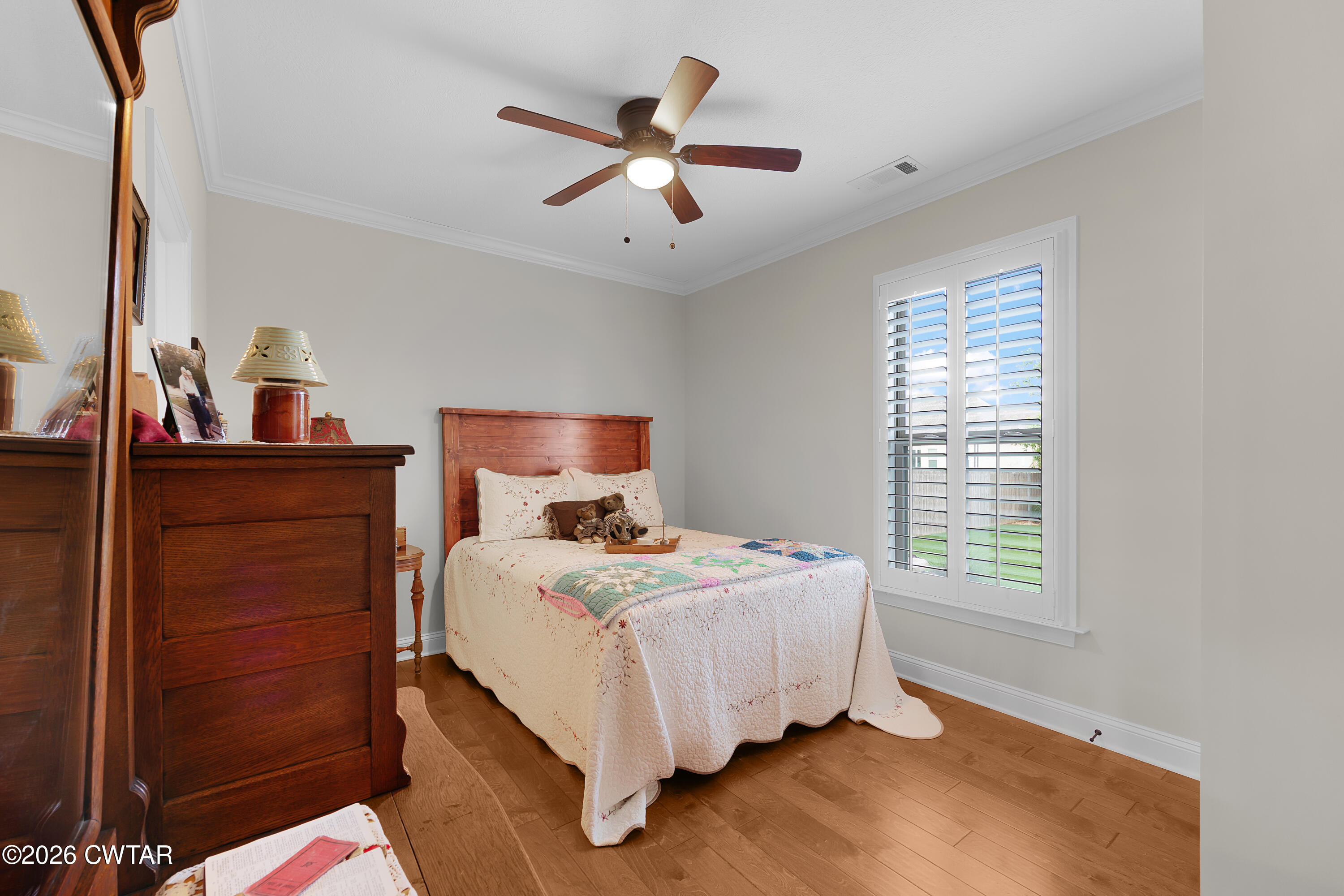 34 Cheddleton Cove Jackson, TN 38305 - Photo 21 of 32 a bedroom with a bed and a window