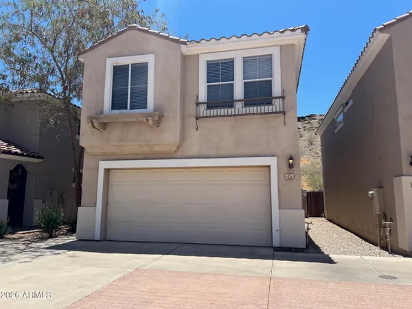 a front view of a house with garage