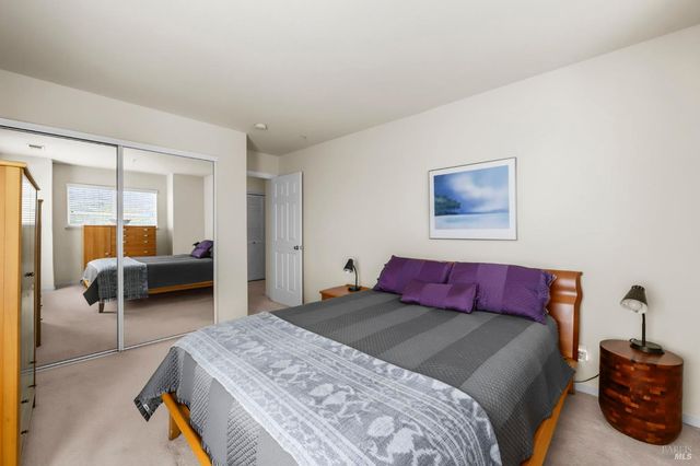 a bedroom with a bed and a couch