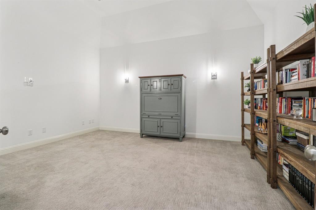 8277 Halifax The Colony, TX 75056 - Photo 29 of 37 an empty room with bookshelf