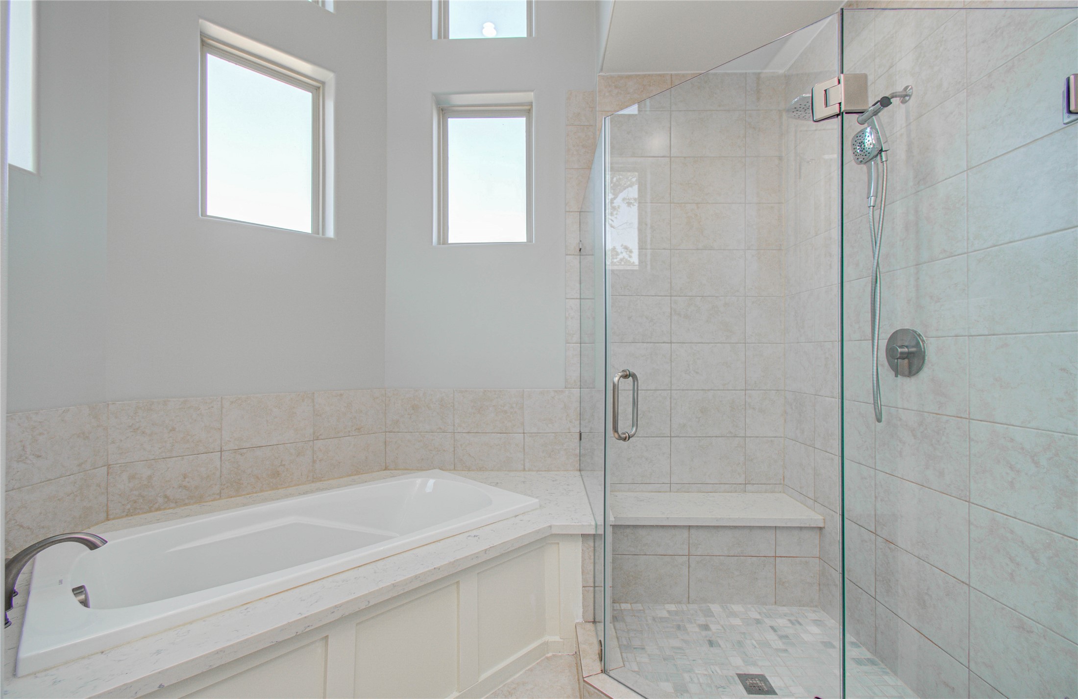 8903 Spring Knoll Forest Drive Houston, TX 77080 - Photo 13 of 29 a bathroom with a bathtub and a shower