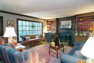 3224 Landor Road Raleigh, NC 27609 - Photo 4 of 10 a living room with furniture and a fireplace