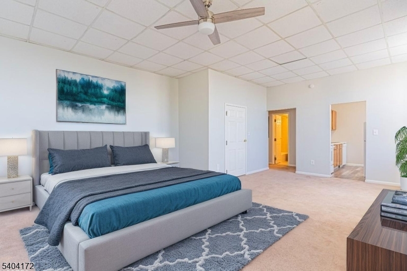 a bedroom with a bed and a couch