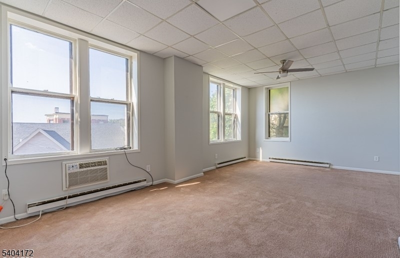 110 Cornelia Street, Unit 3 Boonton, NJ 07005 - Photo 5 of 15 an empty room with windows