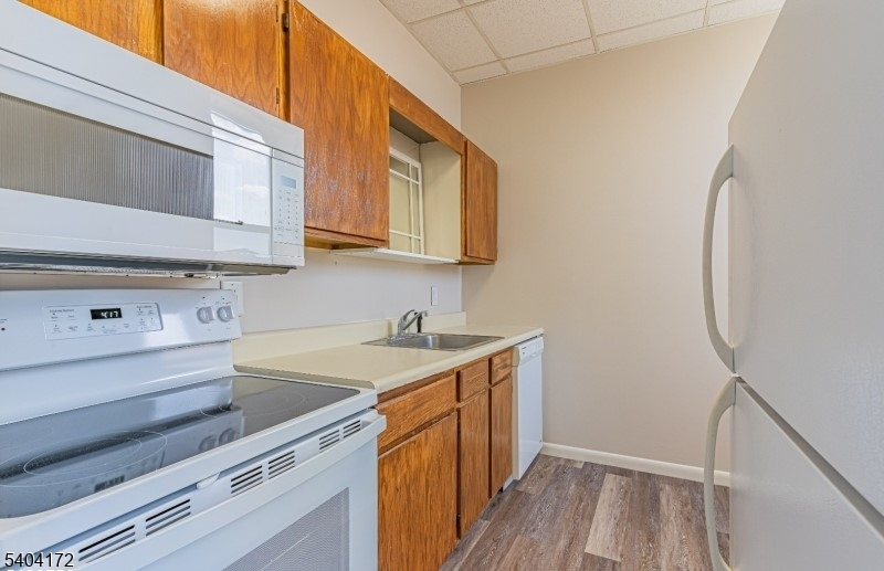 110 Cornelia Street, Unit 3 Boonton, NJ 07005 - Photo 6 of 15 a kitchen with a sink stove and cabinets