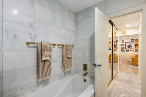 a bathroom with a tub and shower