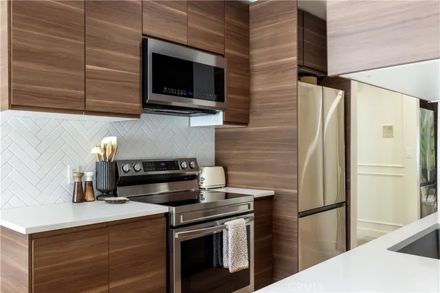 a kitchen with a stove and a microwave