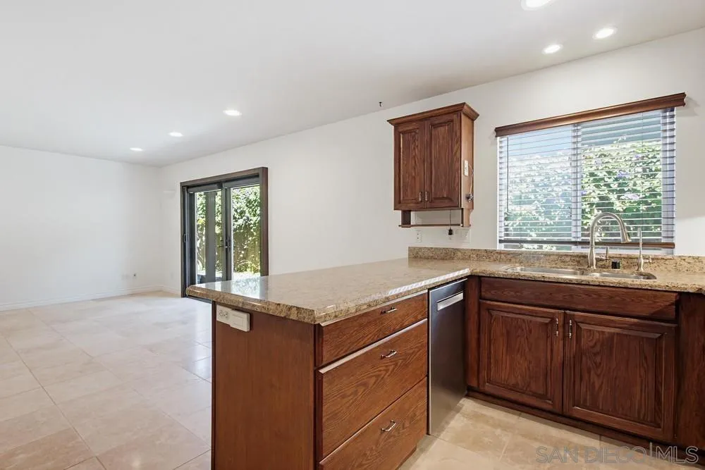545 Bonair Way La Jolla, CA 92037 - Photo 13 of 57 a kitchen with a sink and a window