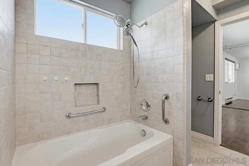 545 Bonair Way La Jolla, CA 92037 - Photo 17 of 57 a bathroom with a bathtub and a shower