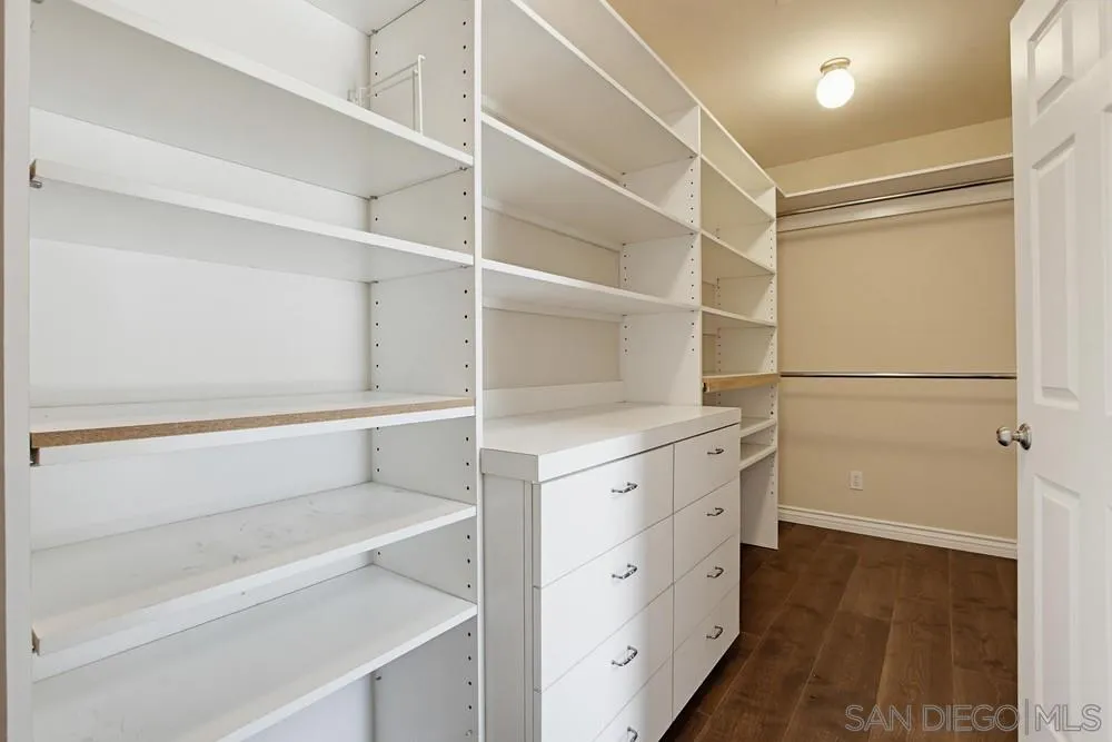 545 Bonair Way La Jolla, CA 92037 - Photo 30 of 57 a view of walk in closet with empty racks