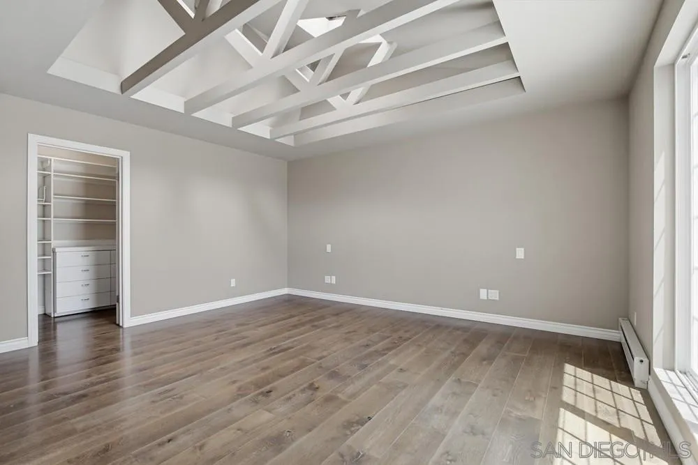 545 Bonair Way La Jolla, CA 92037 - Photo 38 of 57 wooden floor in an empty room with a window