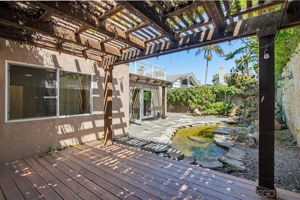 545 Bonair Way La Jolla, CA 92037 - Photo 42 of 57 a view of a porch with furniture and floor to ceiling window