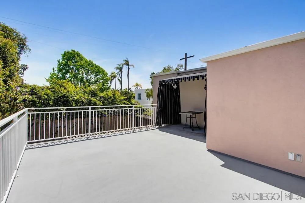 545 Bonair Way La Jolla, CA 92037 - Photo 44 of 57 a view of a deck with a floor to ceiling window and a balcony