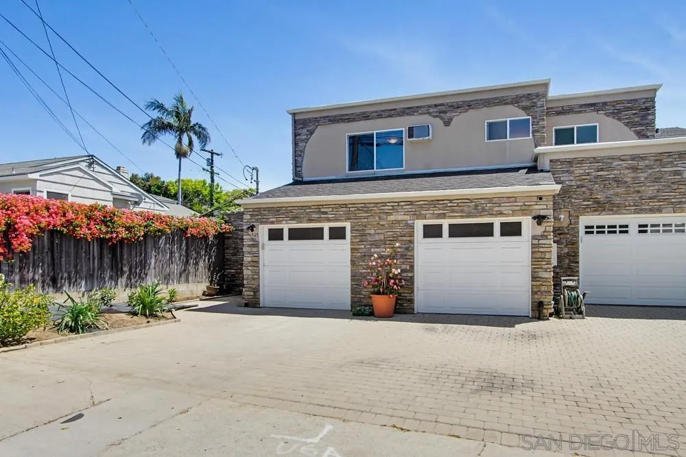 545 Bonair Way La Jolla, CA 92037 - Photo 56 of 57 a front view of a house with a yard and garage