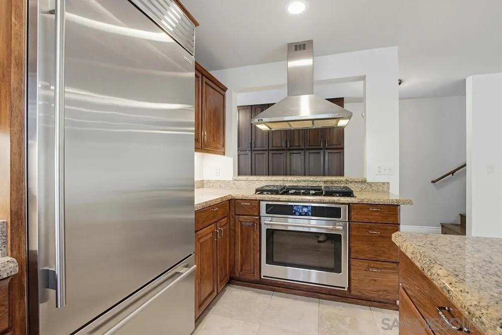 545 Bonair Way La Jolla, CA 92037 - Photo 9 of 57 a kitchen with a stove and a refrigerator