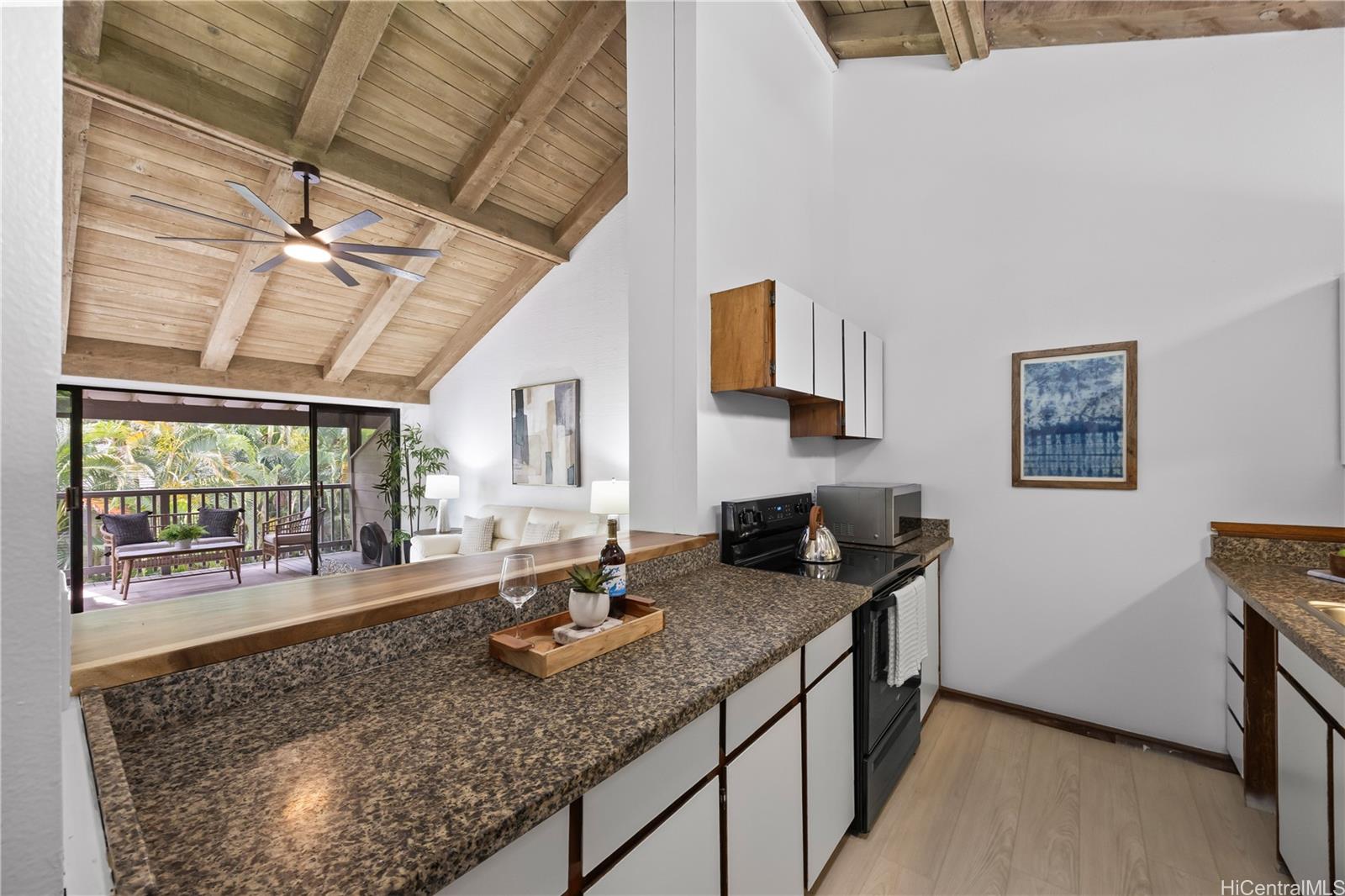 45-995 Wailele Road, Unit 35 Kaneohe, HI 96744 - Photo 10 of 25 Your kitchen opens up to the living room with countertop seating and ample natural light
