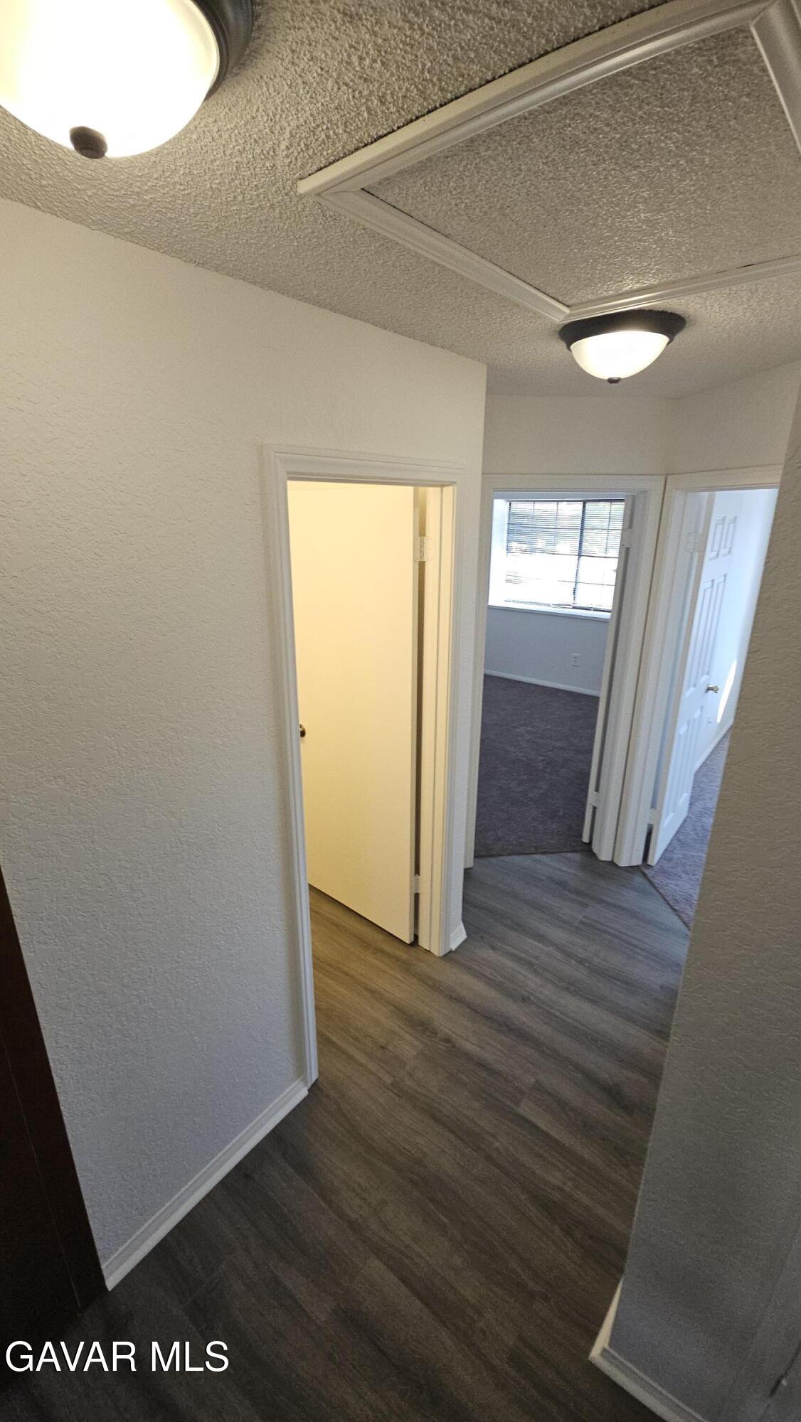 39005 161st Street East Palmdale, CA 93591 - Photo 11 of 27 a view of empty room with wooden floor