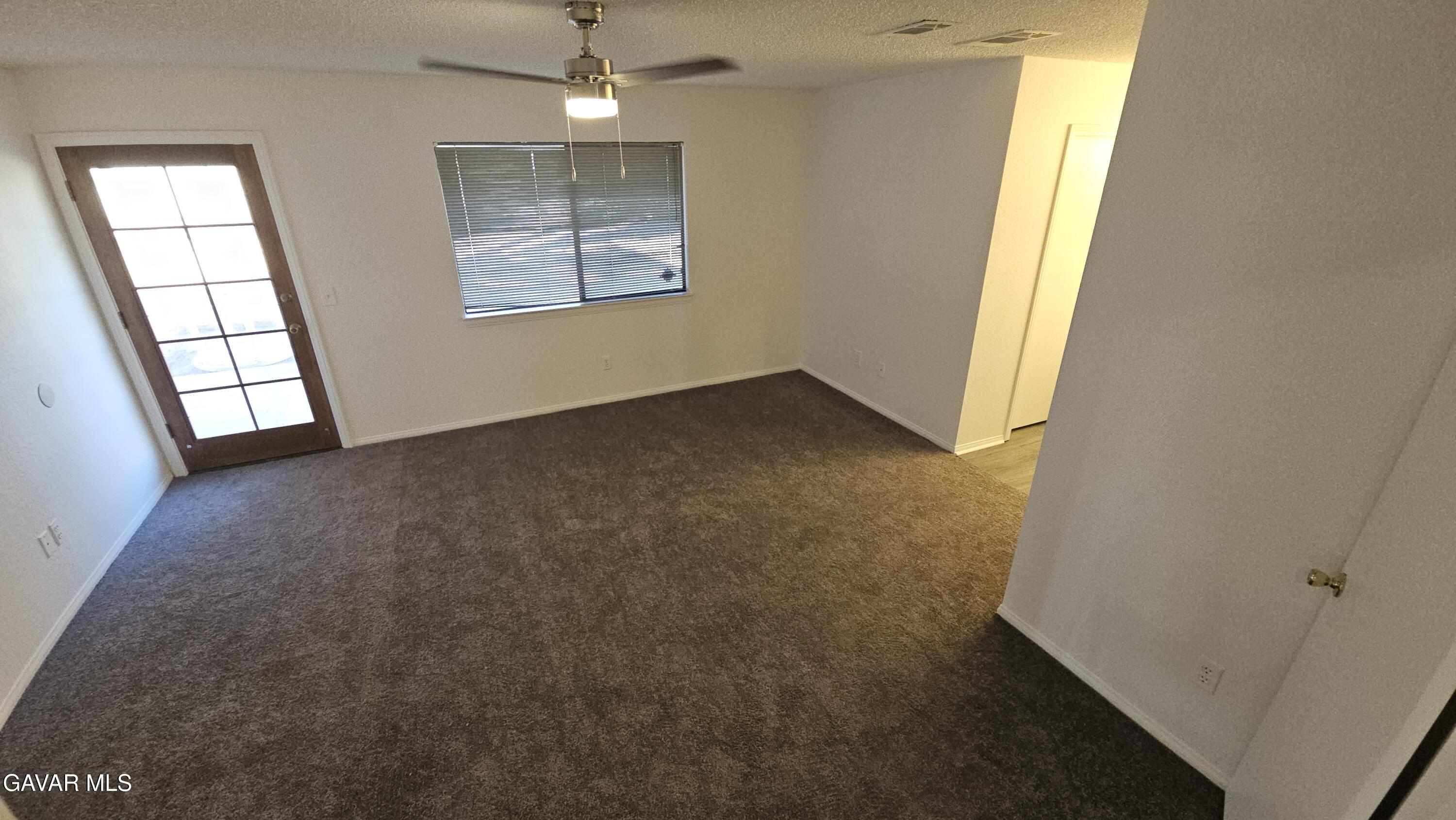 39005 161st Street East Palmdale, CA 93591 - Photo 15 of 27 an empty room with windows and closet