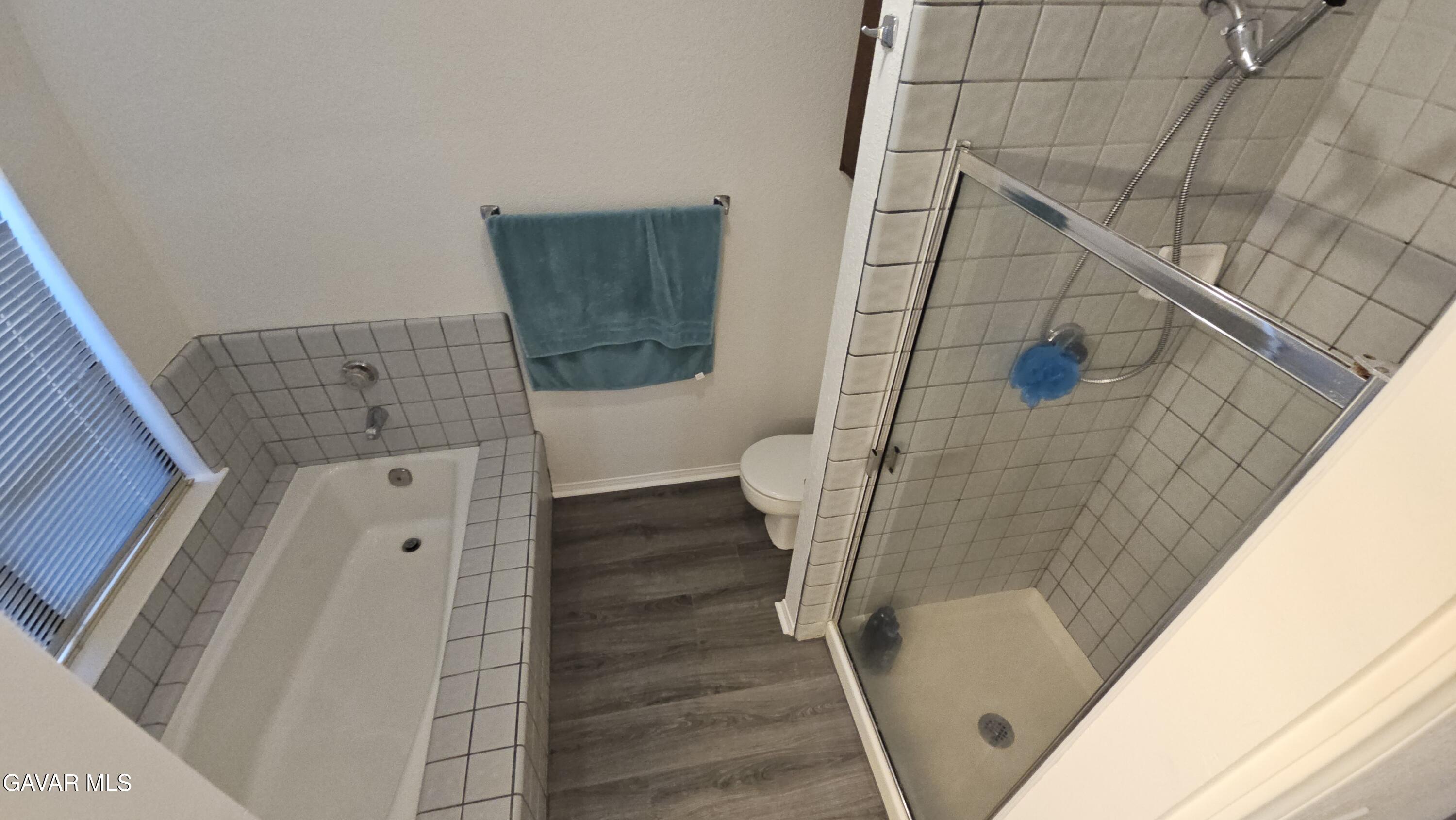 39005 161st Street East Palmdale, CA 93591 - Photo 18 of 27 a bathroom with a sink a toilet and shower