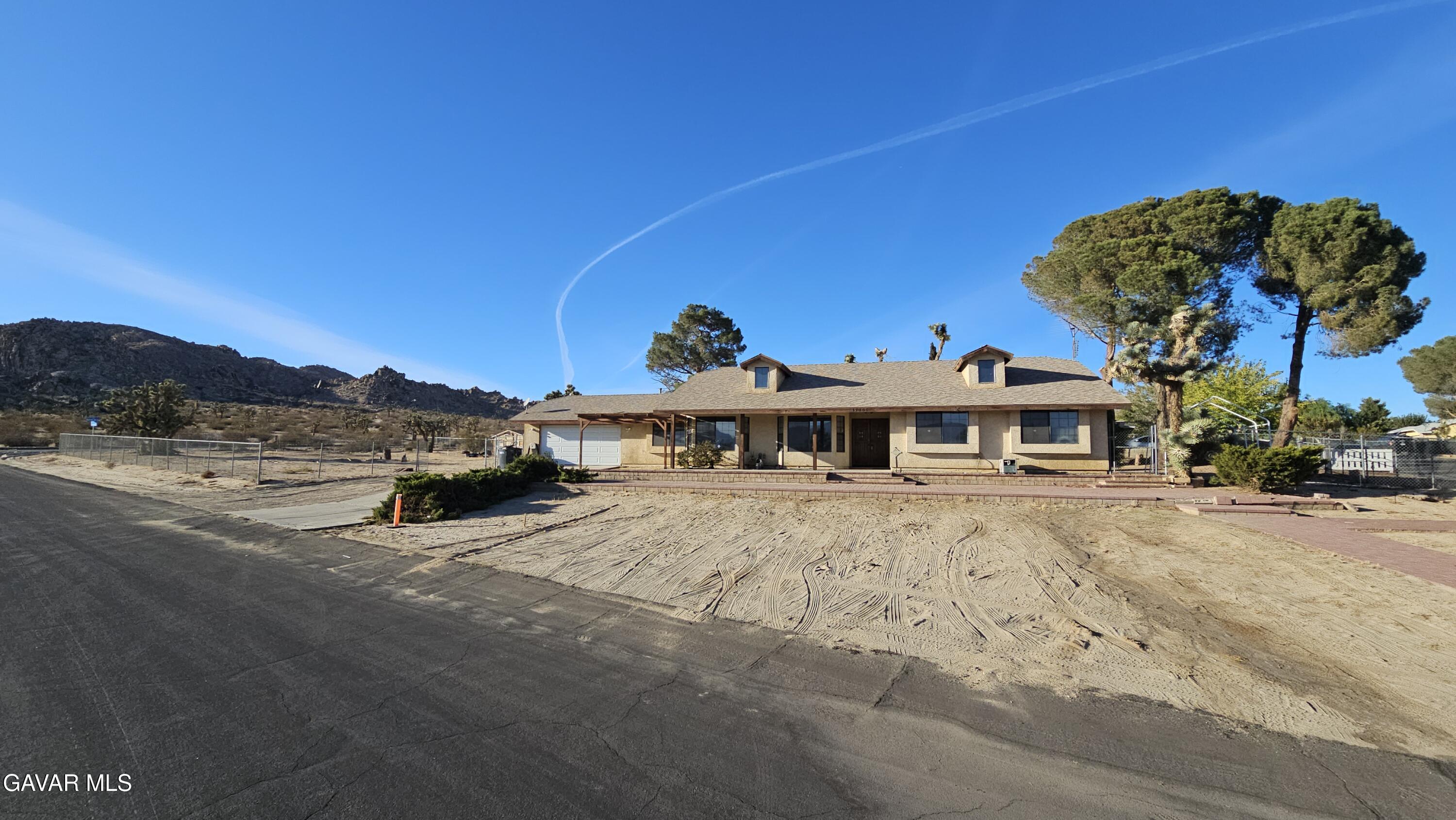 39005 161st Street East Palmdale, CA 93591 - Photo 2 of 27 a view of a house with a yard