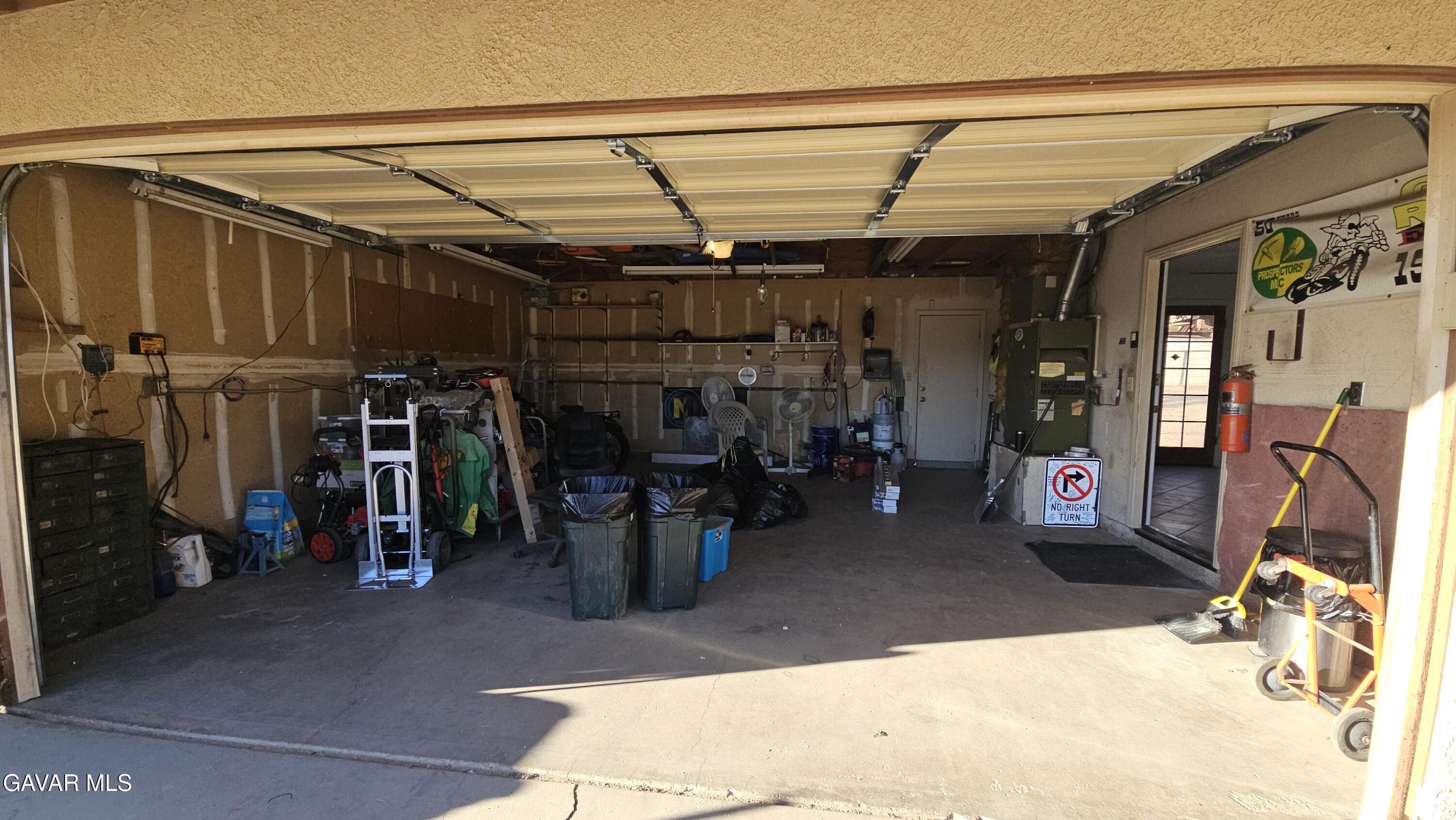 39005 161st Street East Palmdale, CA 93591 - Photo 24 of 27 a view of a storage room with shelves