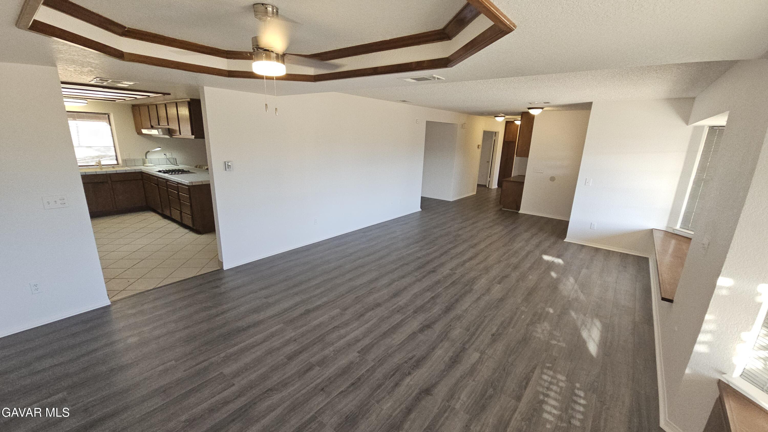 39005 161st Street East Palmdale, CA 93591 - Photo 4 of 27 a view of a hallway view with wooden floor and staircase