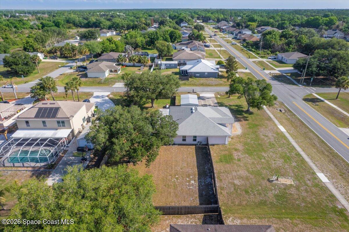 5975 Aruin Street Cocoa, FL 32927 - Photo 51 of 70 an aerial view of a house with a garden