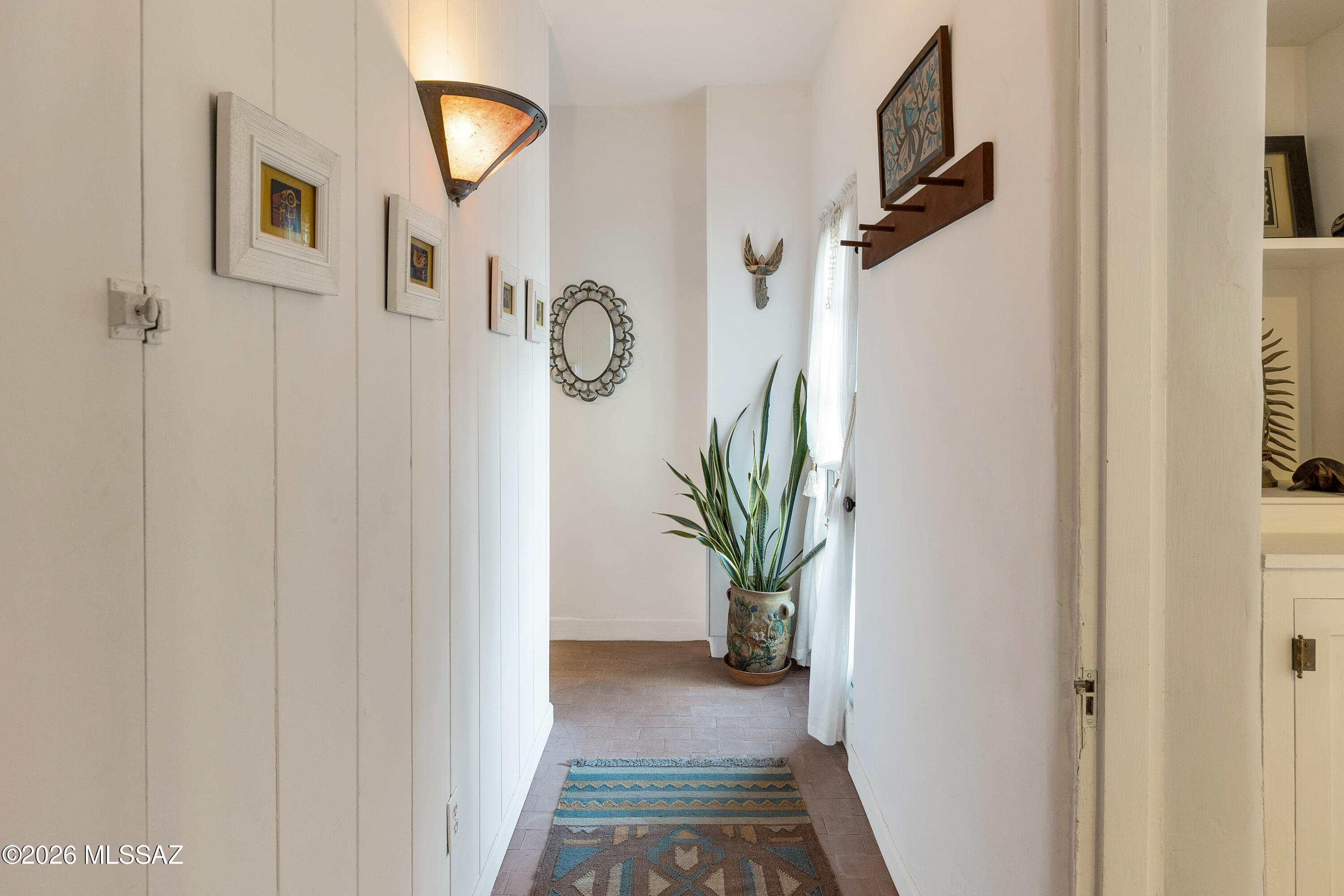 13013 East Redington Road Tucson, AZ 85749 - Photo 14 of 51 Entry hallway is light and bright, with custom details.
