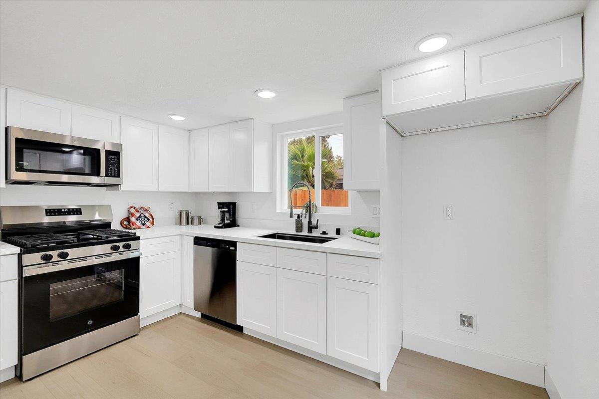 5620 Arboga Road Olivehurst, CA 95961 - Photo 18 of 42 a kitchen with a sink stove and microwave