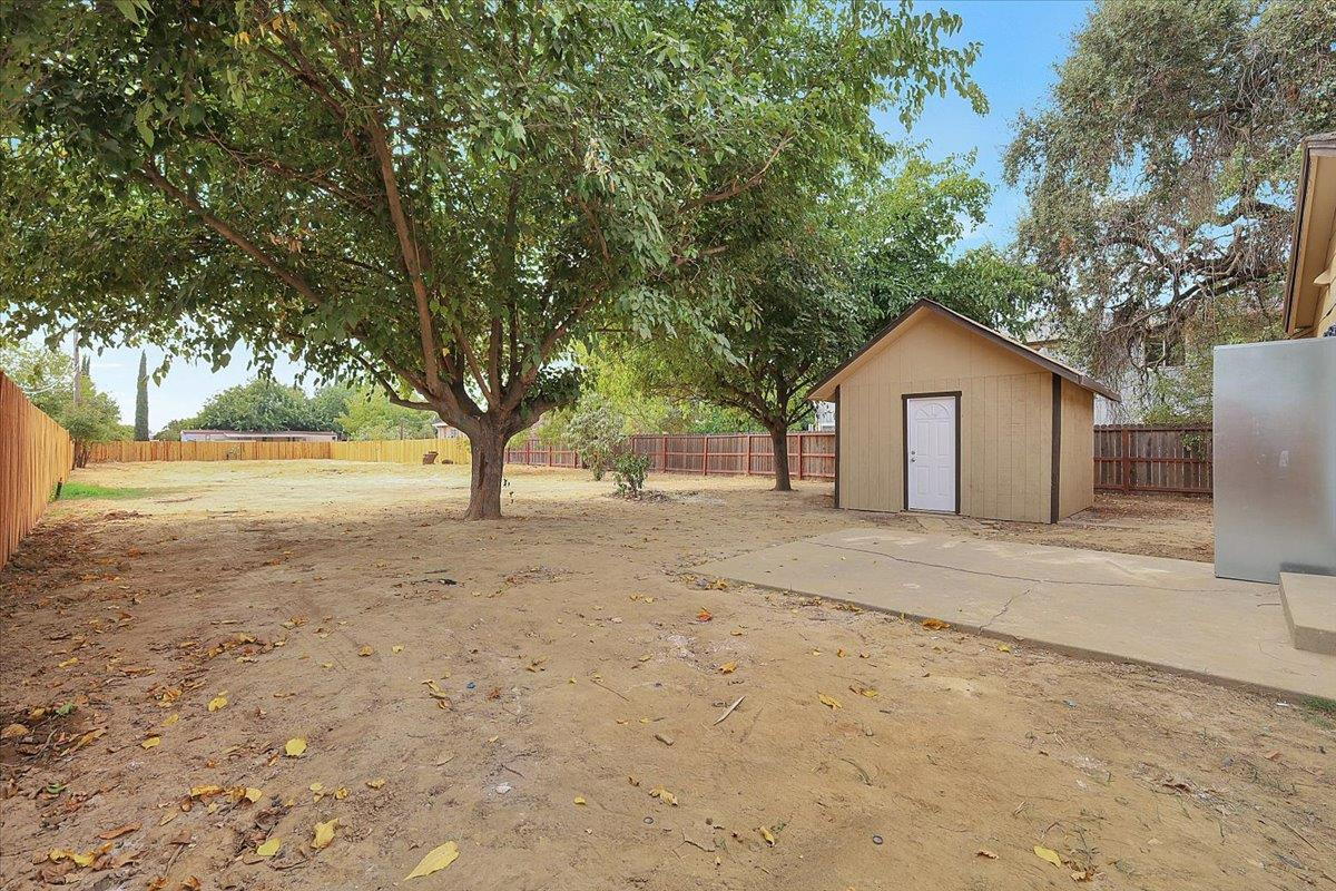 5620 Arboga Road Olivehurst, CA 95961 - Photo 26 of 42 a view of a house with a yard and large tree