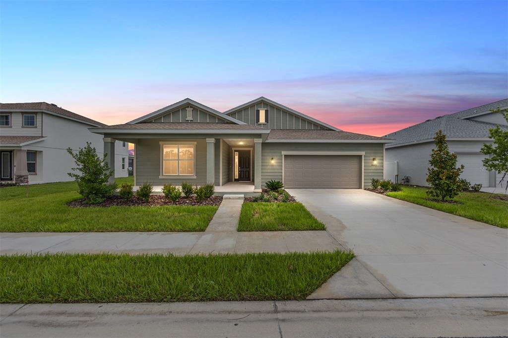 5625 Southwest 78th Ave Road Ocala, FL 34474 - Photo 1 of 1 a front view of a house with a yard and garage