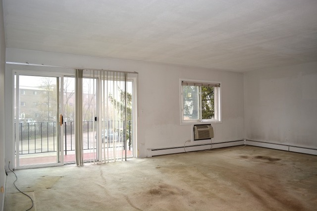 10389 Dearlove Road, Unit 2D Glenview, IL 60025 - Photo 2 of 12 a view of an empty room with a window