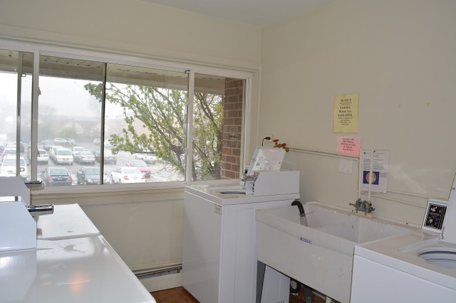 10389 Dearlove Road, Unit 2D Glenview, IL 60025 - Photo 11 of 12 a bathroom with a sink a toilet and a window