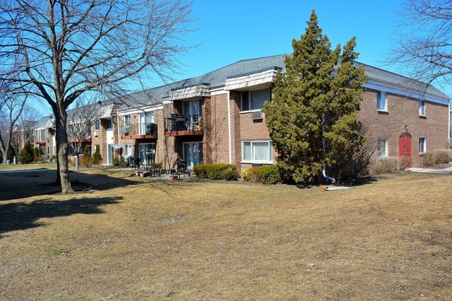 10389 Dearlove Road, Unit 2D Glenview, IL 60025 - Photo 12 of 12 front view of a house with a yard