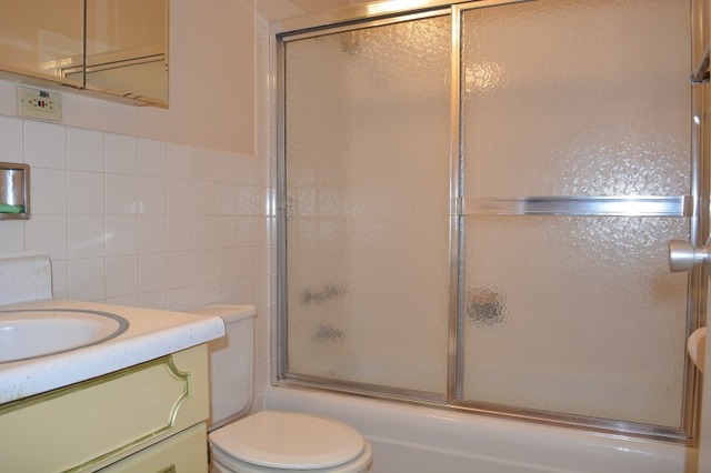 10389 Dearlove Road, Unit 2D Glenview, IL 60025 - Photo 10 of 12 a bathroom with a sink and a mirror