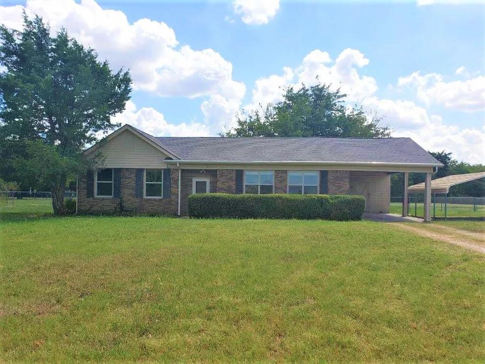 1168 Preston Meadows Road Sherman, TX 75092 - Photo 1 of 20 a front view of a house with a garden