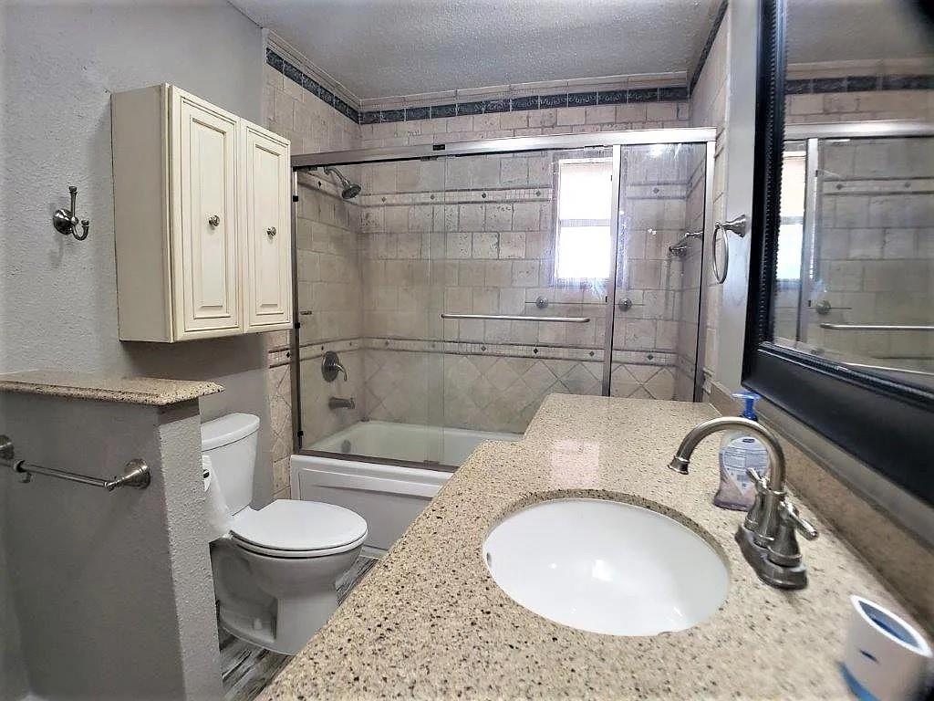 1168 Preston Meadows Road Sherman, TX 75092 - Photo 14 of 20 a bathroom with a sink toilet and shower