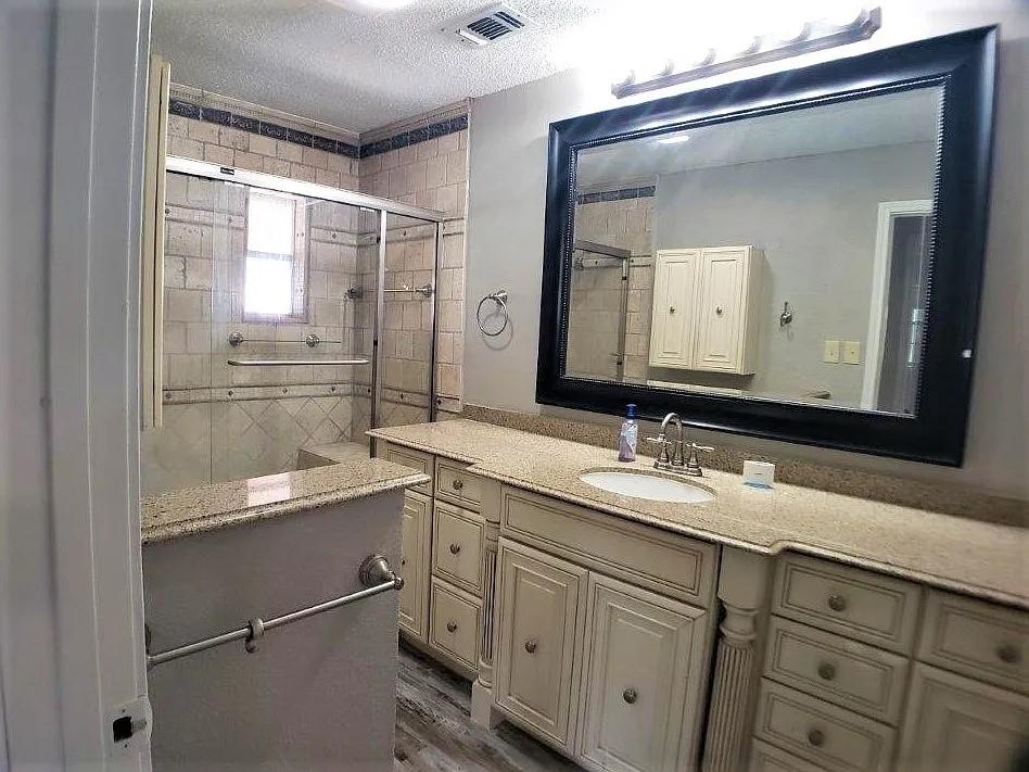 1168 Preston Meadows Road Sherman, TX 75092 - Photo 15 of 20 a bathroom with a granite countertop sink mirror and double