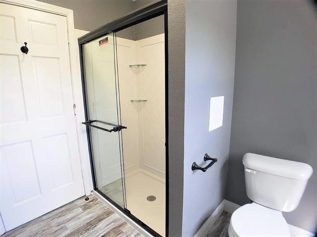 1168 Preston Meadows Road Sherman, TX 75092 - Photo 16 of 20 a bathroom with a toilet and a shower