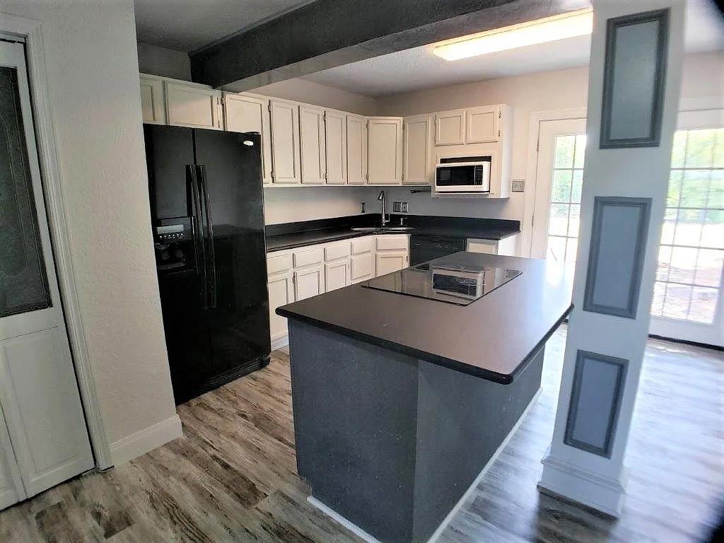 1168 Preston Meadows Road Sherman, TX 75092 - Photo 3 of 20 a kitchen with a refrigerator sink and microwave