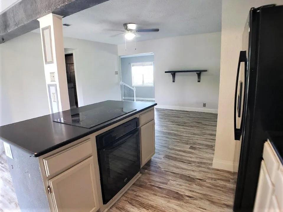 1168 Preston Meadows Road Sherman, TX 75092 - Photo 6 of 20 a kitchen with granite countertop a sink stove and refrigerator