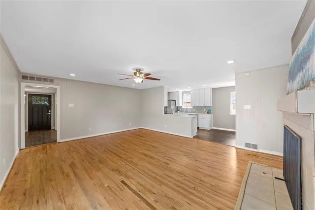 a view of a kitchen with kitchen sink and wooden floor