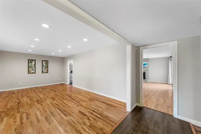 a view of hallway with wooden floor